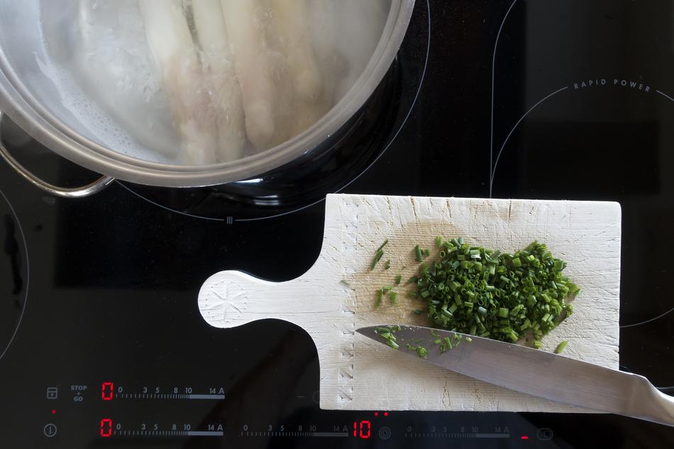 chopped greens on a board