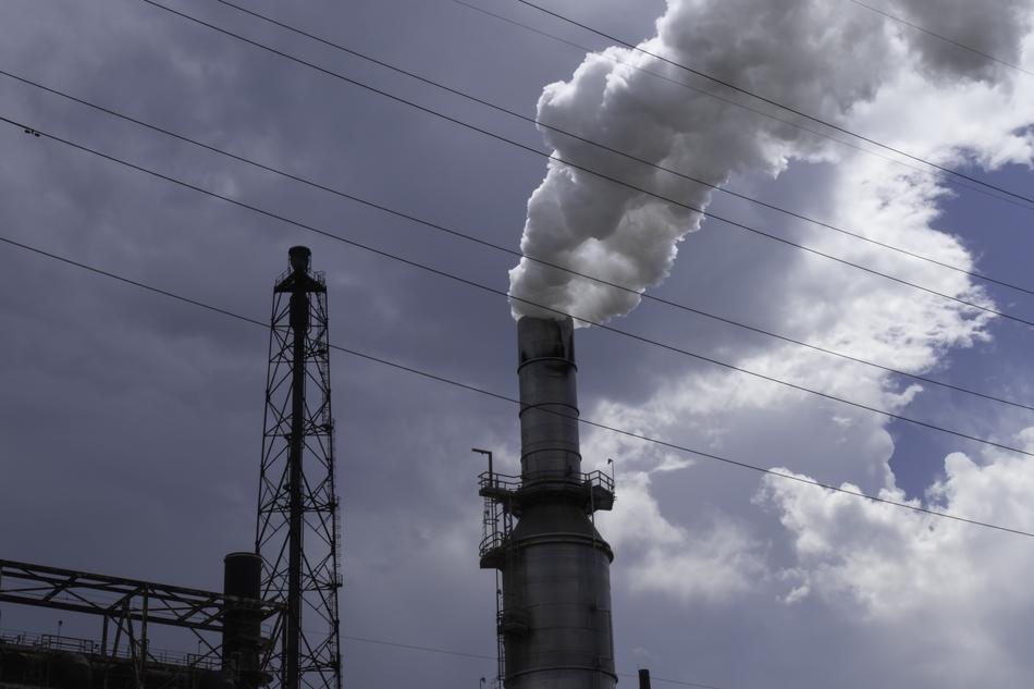 Close-up of the smoke pollution, of the furnace, on the construction, under the blue sky and clouds