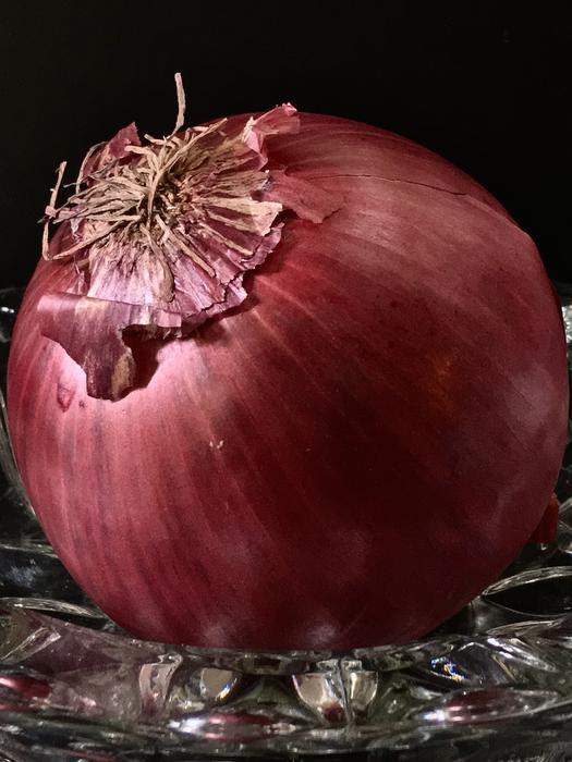 pink unpeeled onions