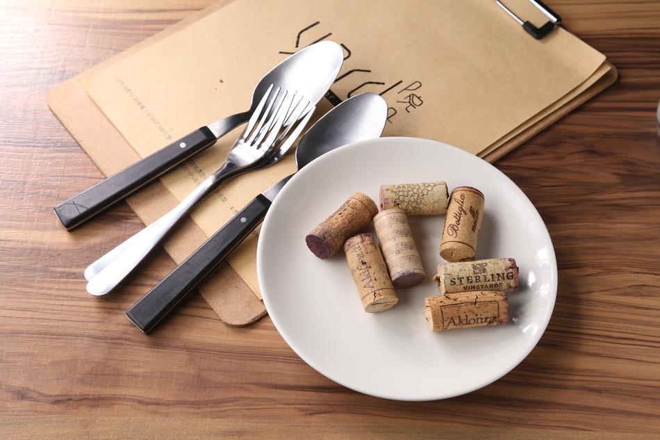 wooden wine stoppers on a plate