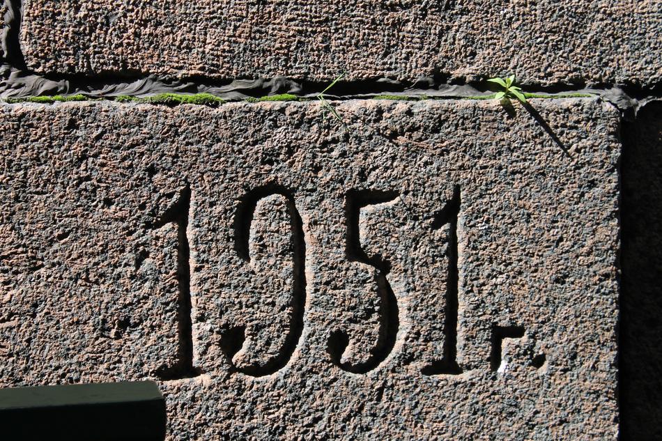 masonry wall with engraved year