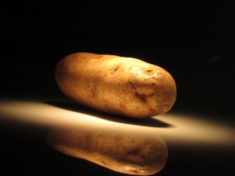 Unpeeled potatoes on a plate