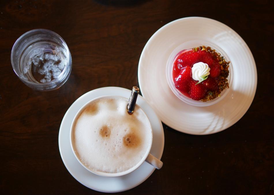 foamy coffee with strawberry dessert