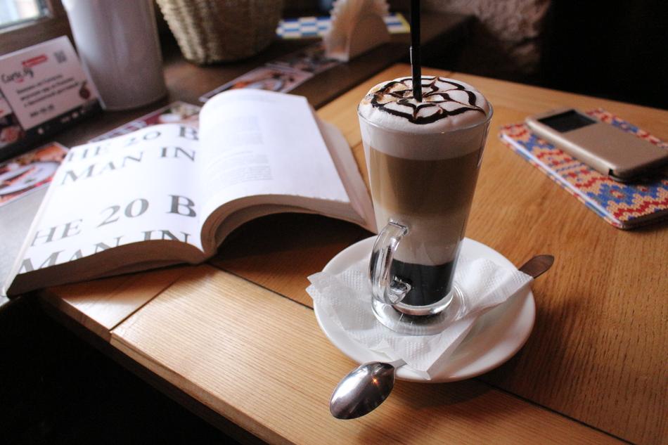 magazine and foam coffee on the table