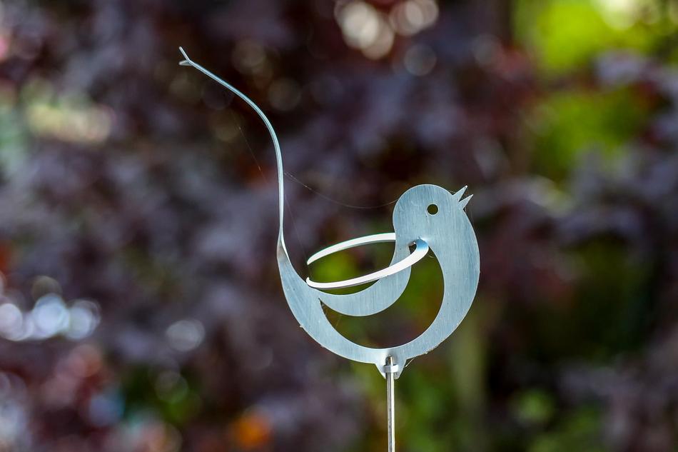 iron figure of a bird in the garden