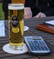 big glass of beer on the table