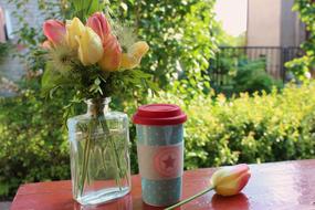 coffee on a background of beautiful flowers