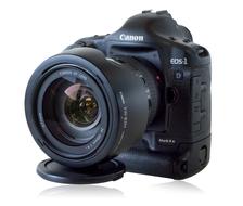 Beautiful, shiny, black Canon D1 camera, with the colorful lens, at white background