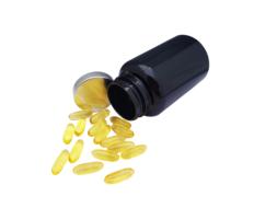 Close-up of the yellow fish oil pills, with the black container, at white background, clipart