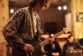 Guitar Musician in cafe