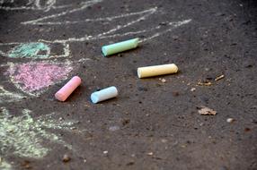 colorful crayons on the asphalt