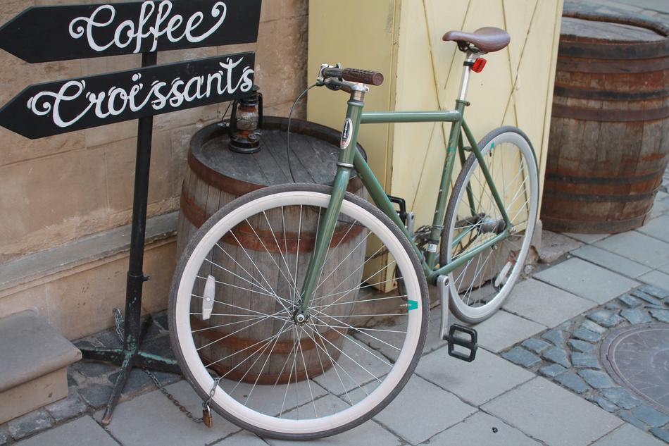 an old bicycle near the barrel