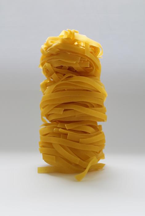 swirled noodles on a white background
