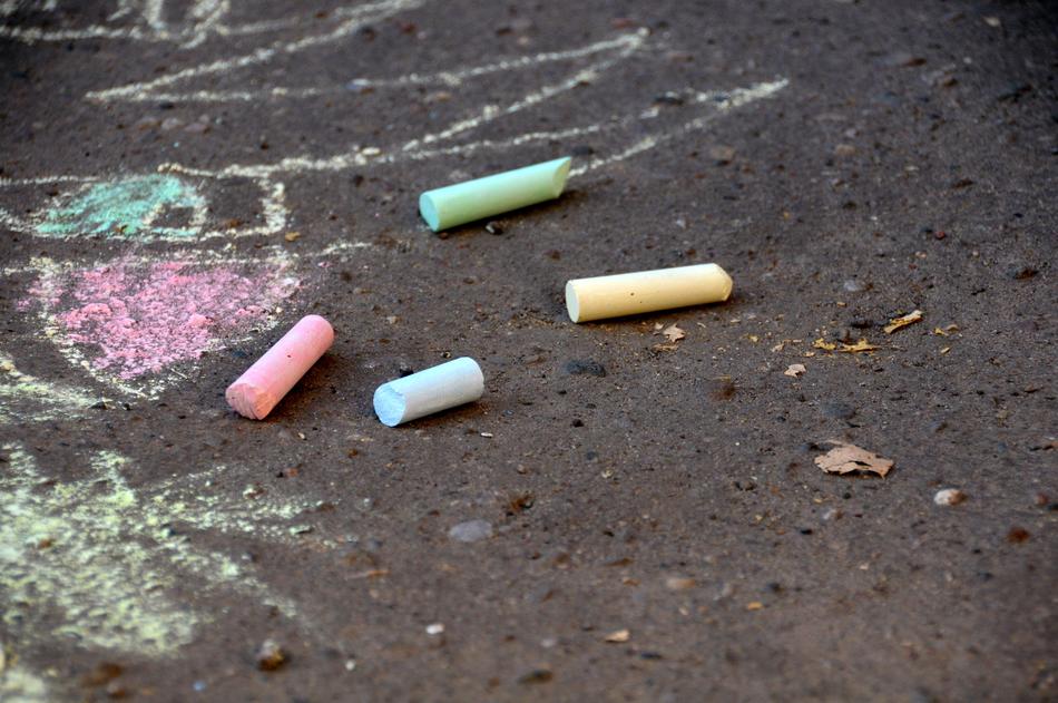 colorful crayons on the asphalt