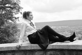 a girl in a black skirt with shoes