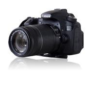 Beautiful, shiny, black Canon Eos 60d camera, with the shiny lens, at white background