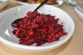 grated beets in a bowl