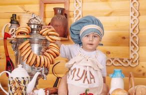 Baby and food on rural kitchen