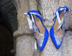 blue shoes of a girl with a bow