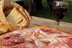 Salty sausage snack and wine
