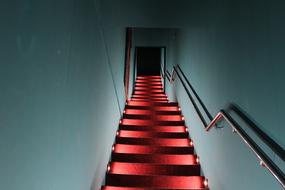 red glowing staircase in the cafe