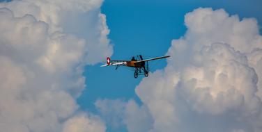 flying helicopter on the background of the sky and clouds