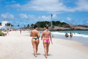 People on beach bay in summer