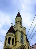 there's a beautiful yellow church standing