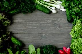 Green vegetables on a wooden table