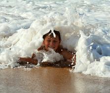 boy on seashore at water