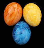beautifully painted eggs on a black background