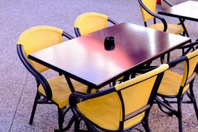 yellow chairs near the table