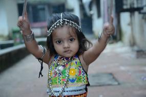 indian little girl dancing in national costume