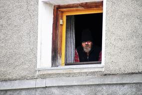 A Person looking from Window Sill