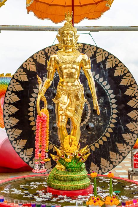 golden sculpture of a man view