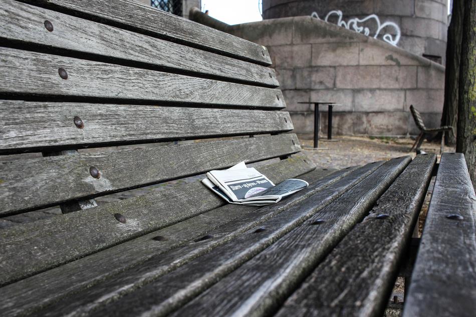 newspaper on wooden Bank Seat