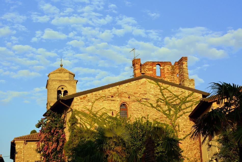 yellow stone house with trees