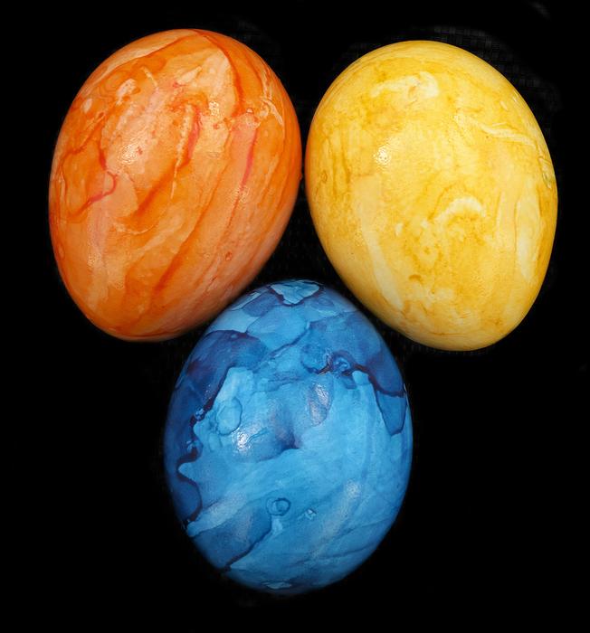 beautifully painted eggs on a black background