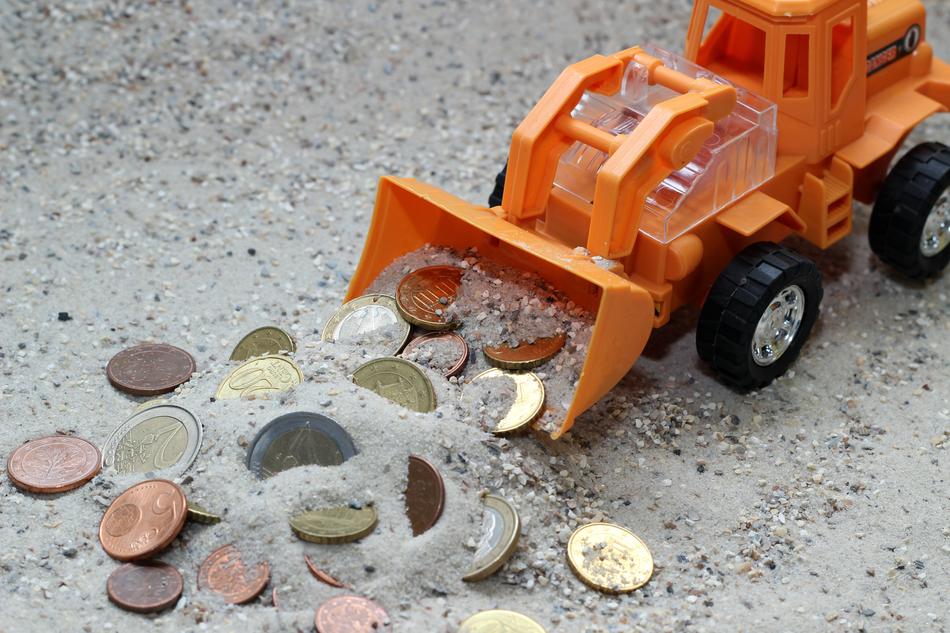 coins in the sand as a concept design