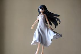 Japanese figurine of the young lady in violet dress