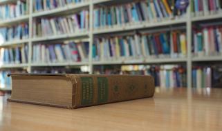 book on the table in the library on a blurred background