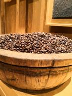 roasted coffee beans in a wooden plate