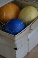 colored holiday eggs in a wooden box