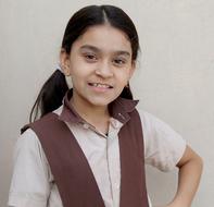 Portrait of the smiling girl in the Indian school