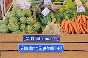 fresh vegetables in a box with a signature