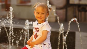 The Little Girl Child and water fountain