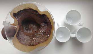 frothy hot coffee in a cup