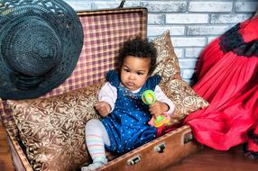 African Girl Child in suitcase
