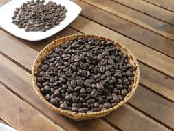 coffee beans in a wooden plate