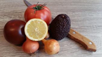 Fresh fruit and vegetables near the knife